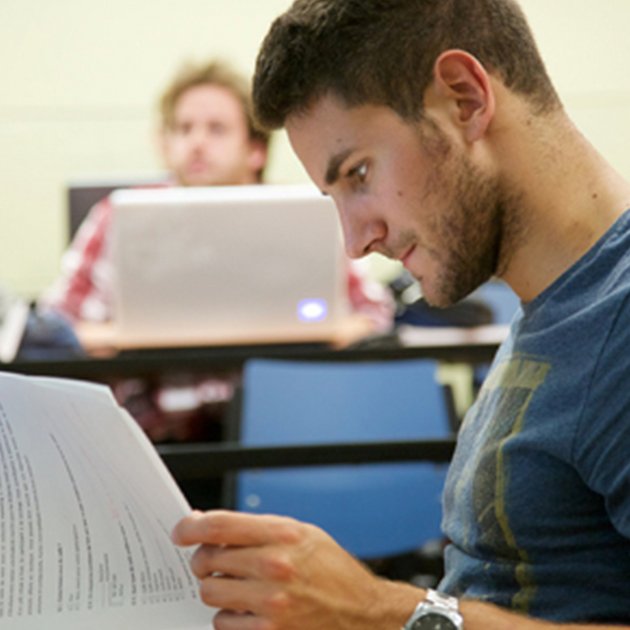 A student reads a document.